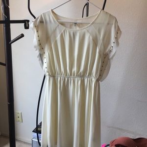 Creme colored dress w/ gold studs on sleeves.